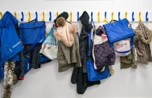 School coat pegs in a hallway, representing the closure of St Lawrence College in Ramsgate