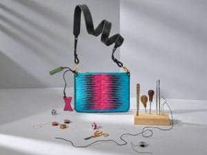 The Sophia 21 handbag in turquoise and pink leather, with leatherworking tools